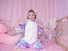 COZY ANAL: a baby in jammies plays with