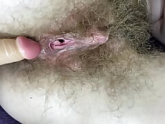 Unshaved damsel smashes her wet big clit